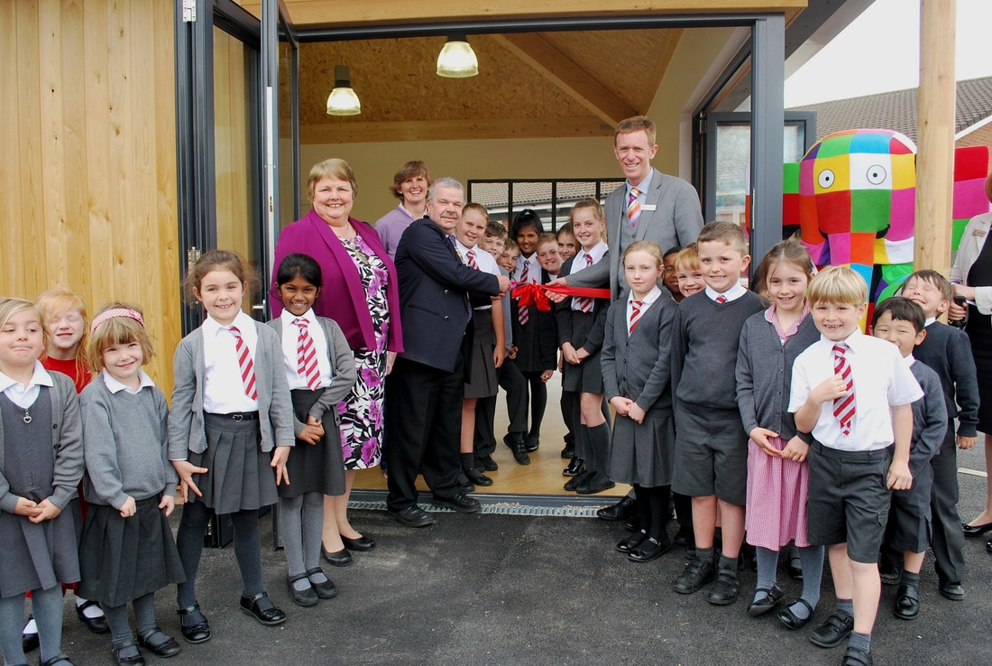 Smiles all round as Cuddington Croft celebrates opening of new school library building